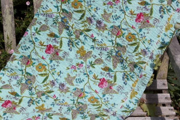 Green-blue floral bedcover