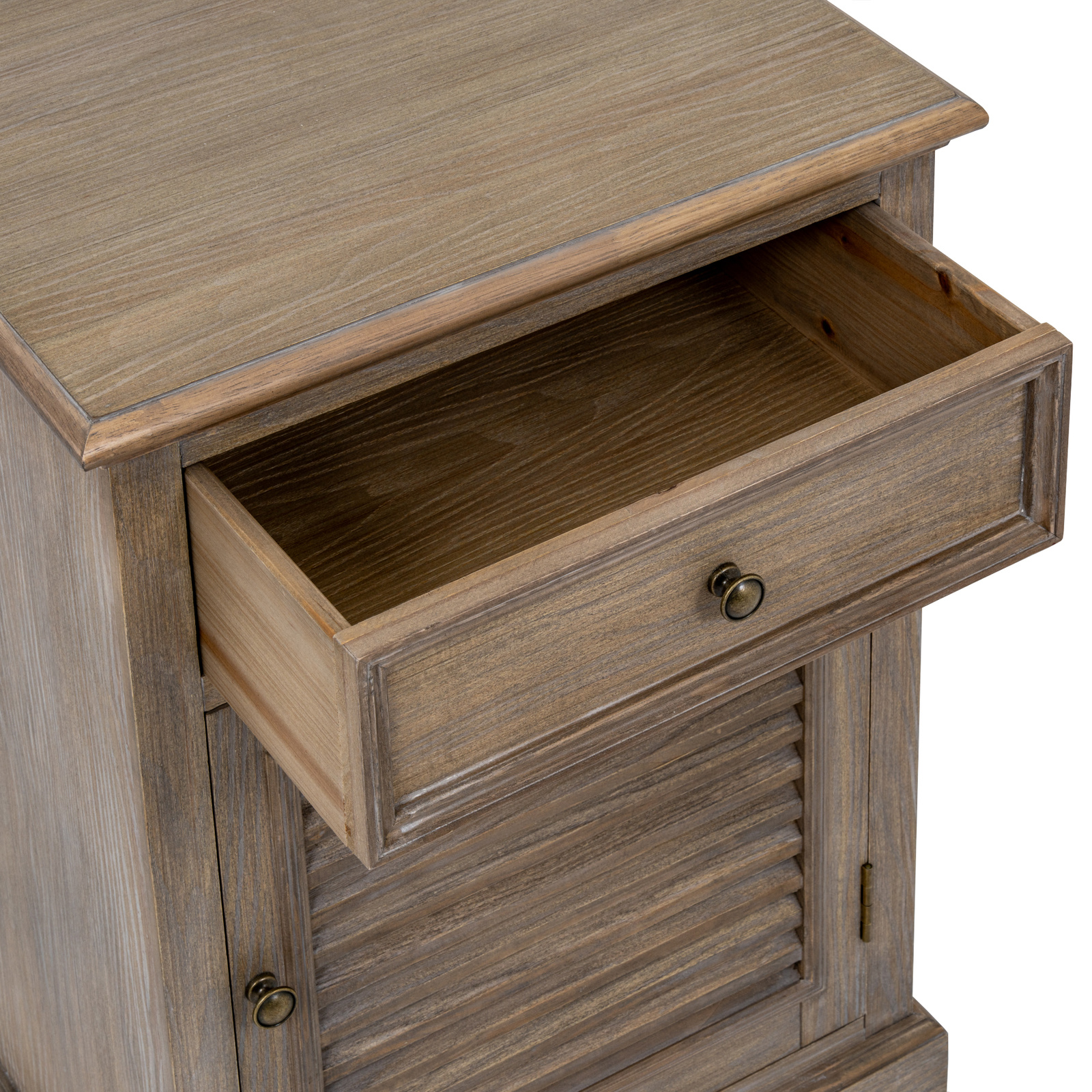 The image shows a view from above of a brown wood cabinet with one drawer above a single door with the handle on the left and hinges on the right side of the door. The drawer is open.